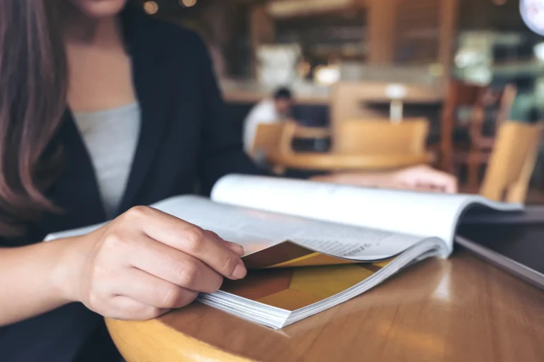 closeup-image-business-woman-reading-book-modern-cafe (1)